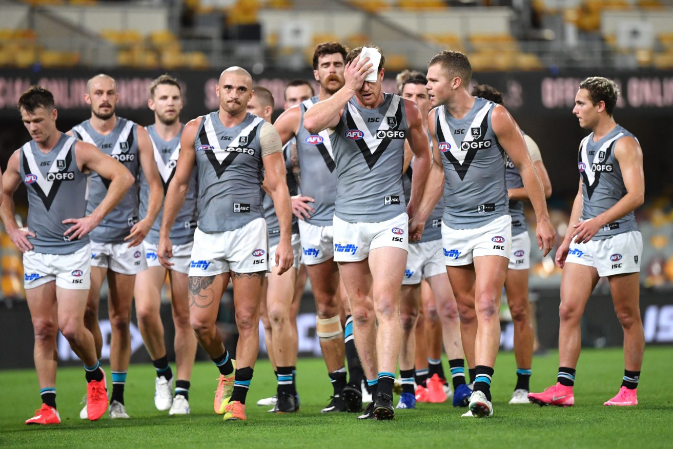 Port Adelaide Football Club players are embroiled in controversy after it was revealed SA Health granted some of their family members exemptions to travel into SA. Photo: Darren England/AAP