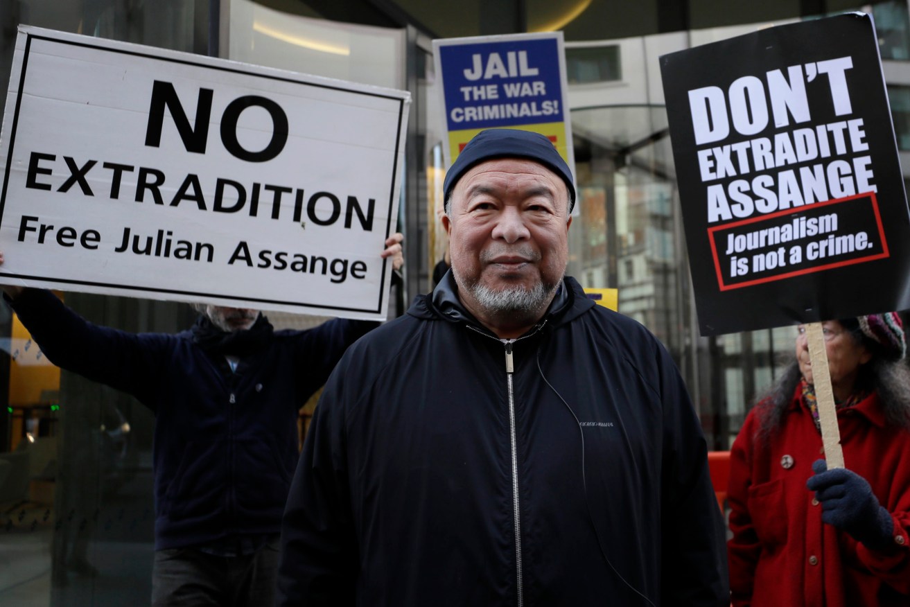 Chinese contemporary artist and activist Ai Weiwei stands with protesters outside the Old Bailey in support of Julian Assange's bid for freedom. Photo: AP/Kirsty Wigglesworth