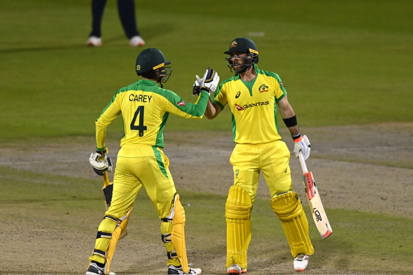 Australia's Glenn Maxwell (right) and Alex Carey starred in the victory against England in Manchester this morning. Picture: Shaun Botterill/NMC Pool/PA Wire. 