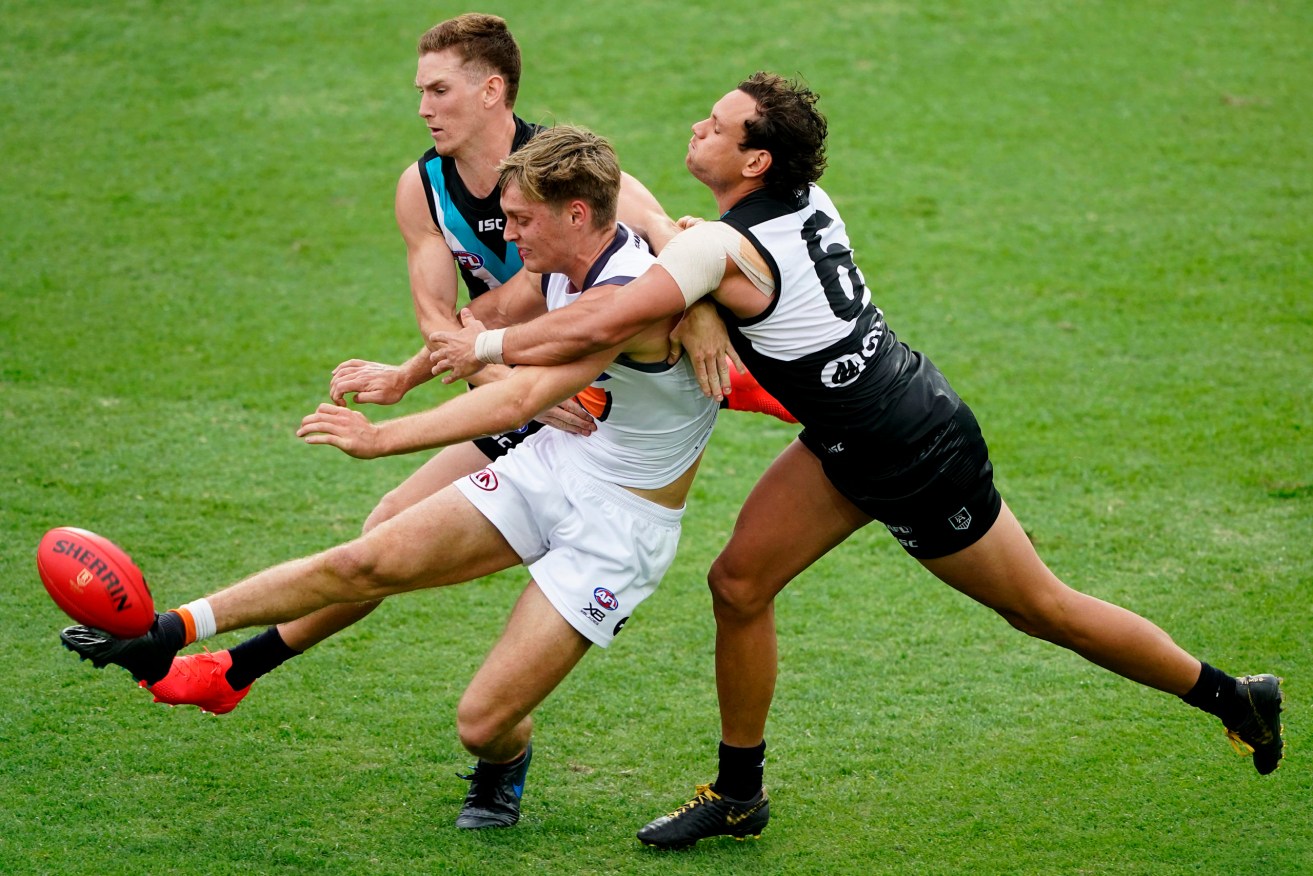 Jackson Hately in action against Port Adelaide. Photo: AAP/Dave Hunt