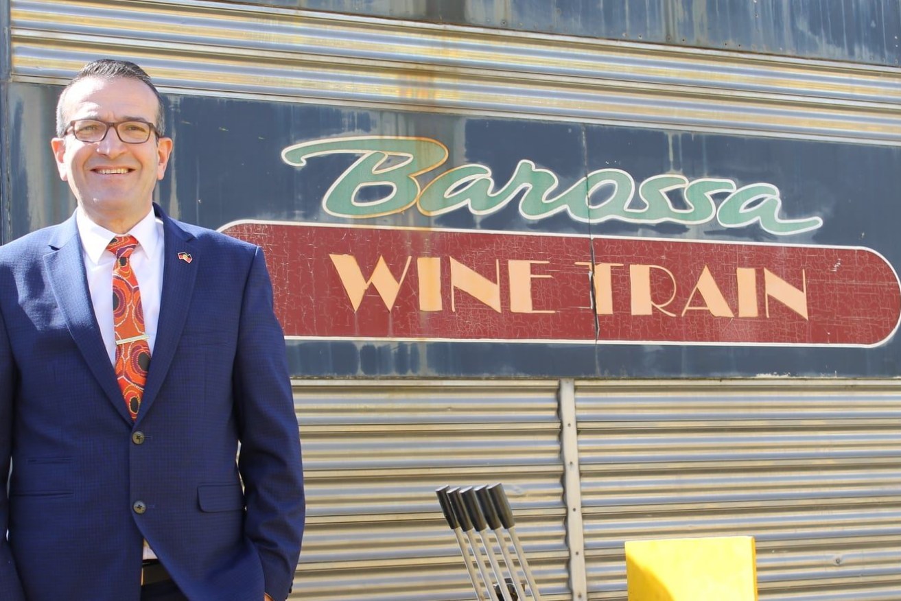 Tony Piccolo poses with the shuttered Barossa Wine Train - a cause close to the heart of voters in Schubert, which he is no longer contesting. Photo: Facebook