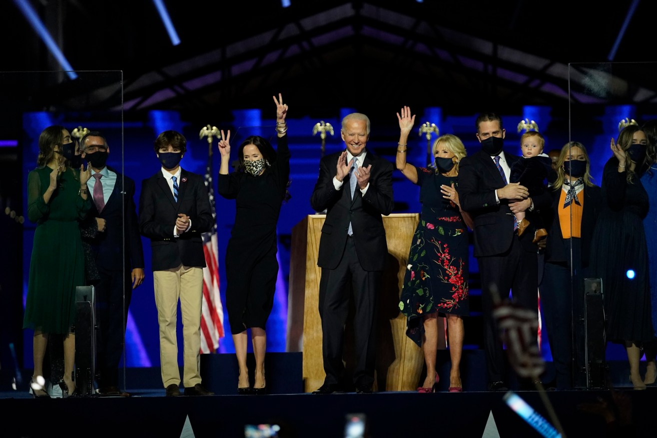 President-elect Joe Biden members of his family on stage waving to supporters in Wilmington, Del. Image: AP/Andrew Harnik.