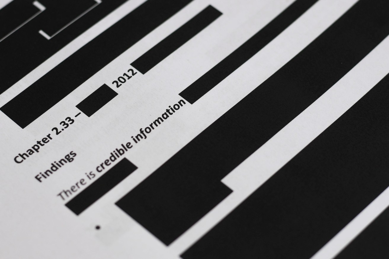 Redacted parts of the report by the Inspector-General of the Australian Defence Force Afghanistan Inquiry. Photo: AP/Lukas Coch
