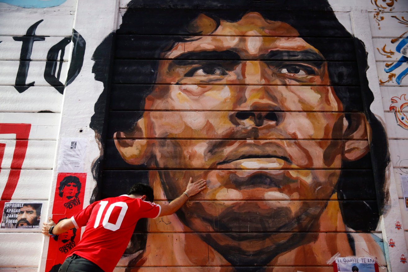 A mural of Diego Maradona outside the stadium of Argentinos Juniors soccer club, where he began as a professional footballer. Photo: AP/Marcos Brindicci