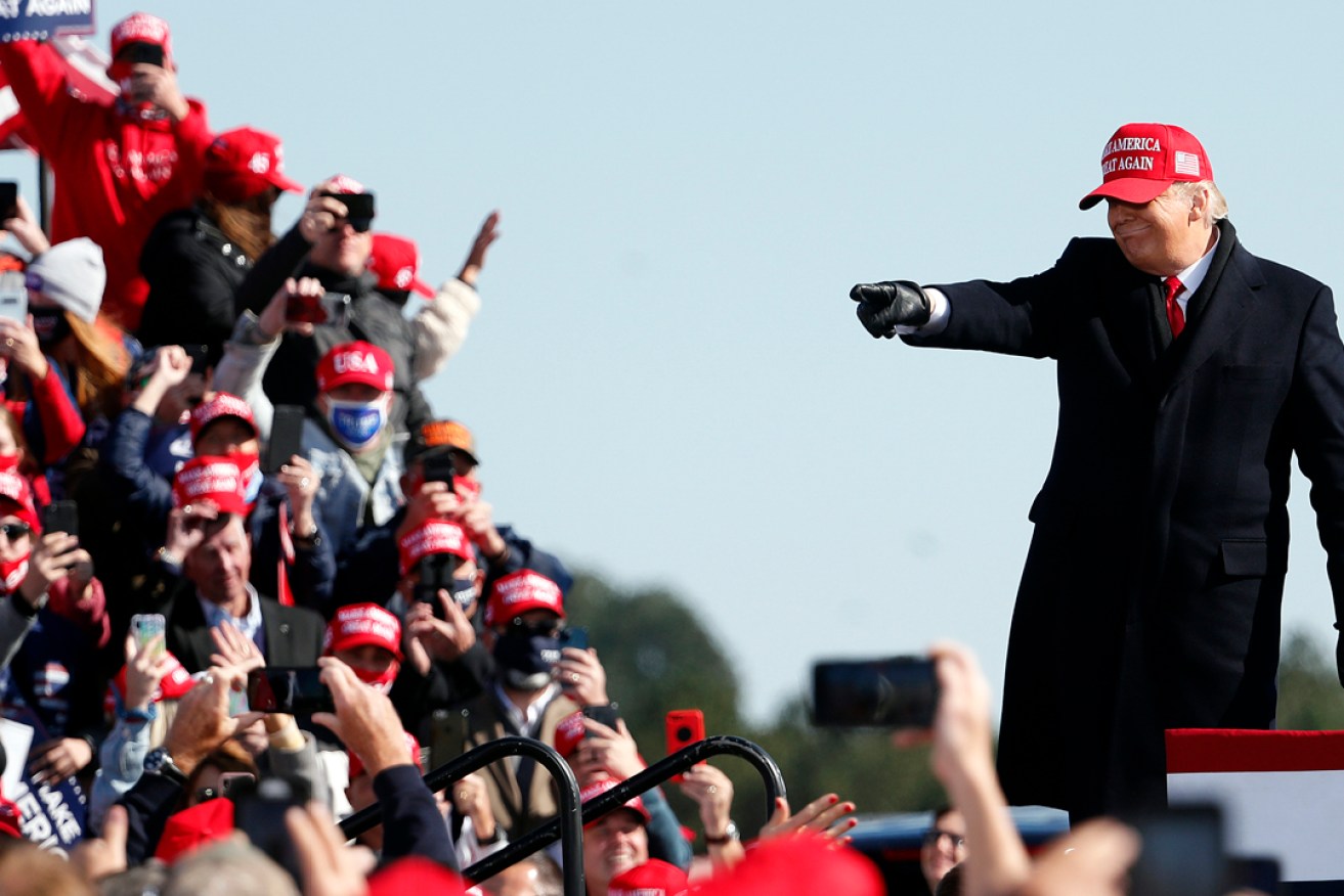 President Donald Trump acknowledges the crowd following a speech at a November 2 rally in North Carolina. Picture: Karl DeBlaker/AP