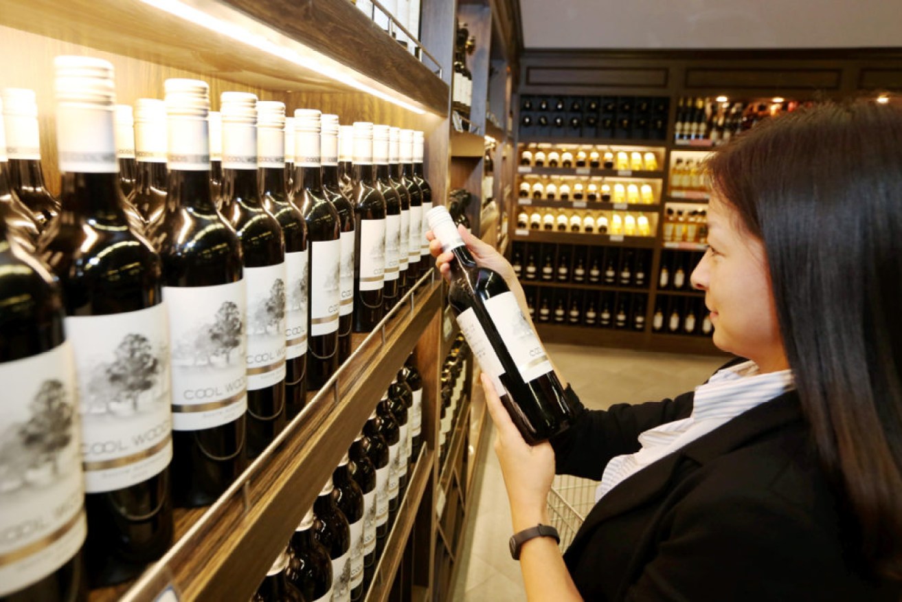 A customer shops for imported wine in a Chinese sales centre. Photo: AP