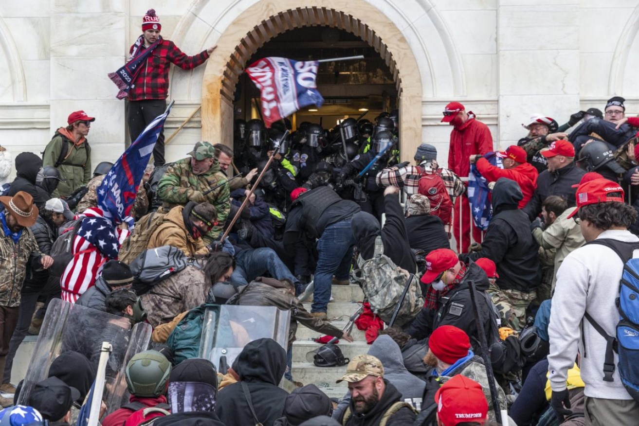 Trump supporters break into the US Capitol in a bid to stop Congress ratifiying the election result after the defeated former president claimed it was fraudulent. Photo: Lev Radin/Sipa USA