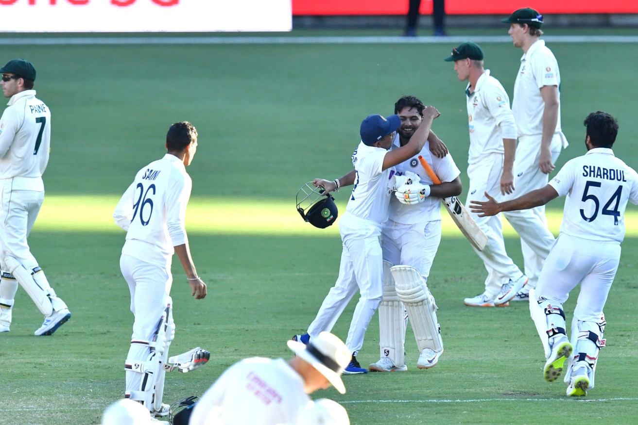 Rishabh Pant celebrates with teammates after victory on day five of the fourth Test. Photo: Darren England / AAP