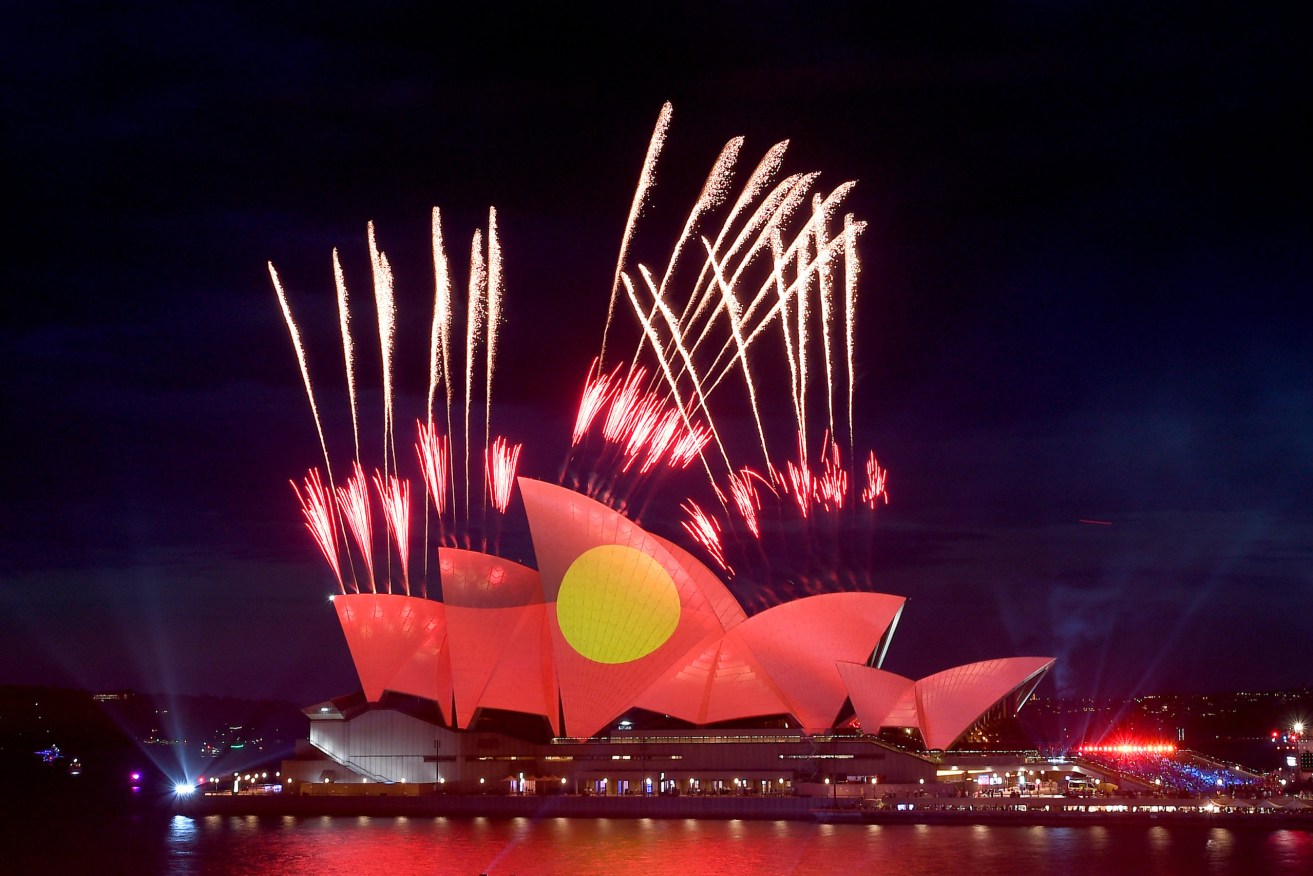 The Aboriginal flag is projected onto Sydney Opera House during Australia Day celebrations. Photo: AAP/Dan Himbrechts