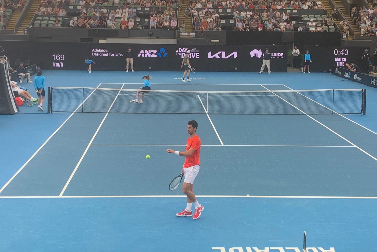 Novak Djokovic belatedly takes to the court at Memorial Drive. Photo: Daniel Gannon via Twitter