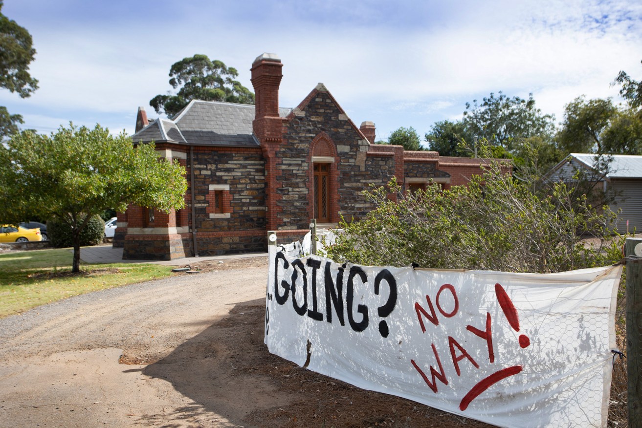 A protest banner outside the Urrbrae gatehouse. Photo: Tony Lewis/InDaily