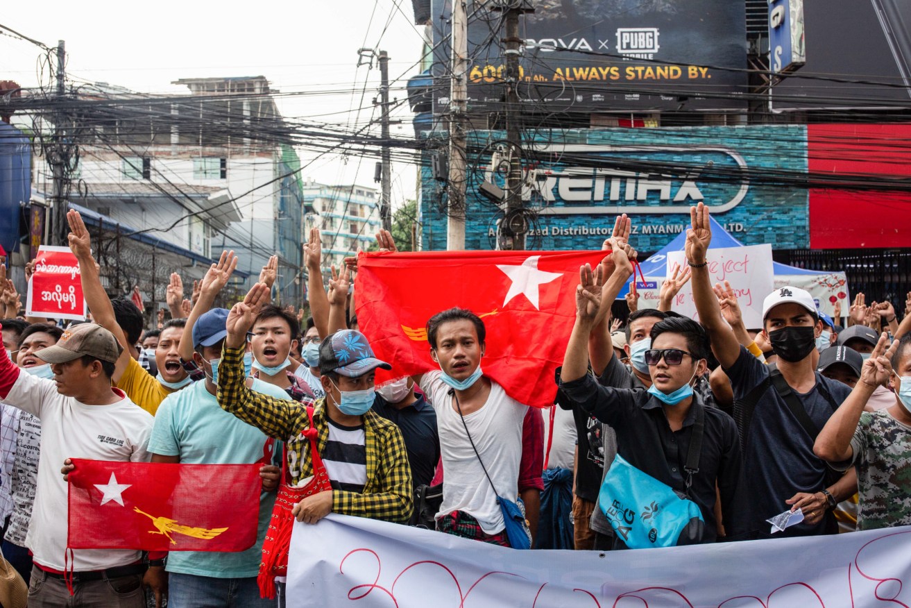 Protesters hold National League for Democracy flags and shout slogans during a demonstration against the military coup in Myanmar. Image: Aung Kyaw Htet/SOPA Images/Sipa USA