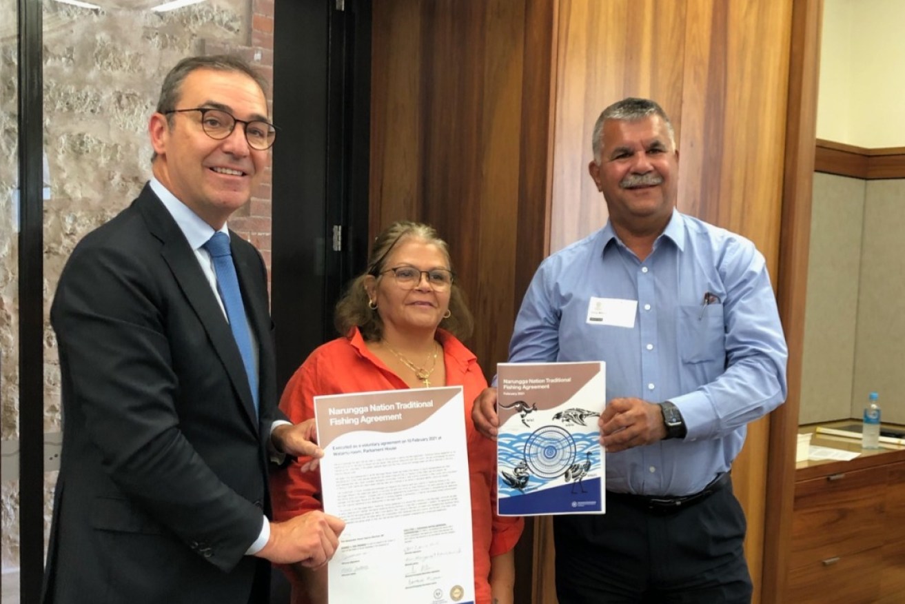 Premier Steven Marshall with Narungga Nation Aboriginal Corporation Chair Anne Newchurch and Director Doug Milera with the Traditional Fishing Agreement. Photo: Supplied 