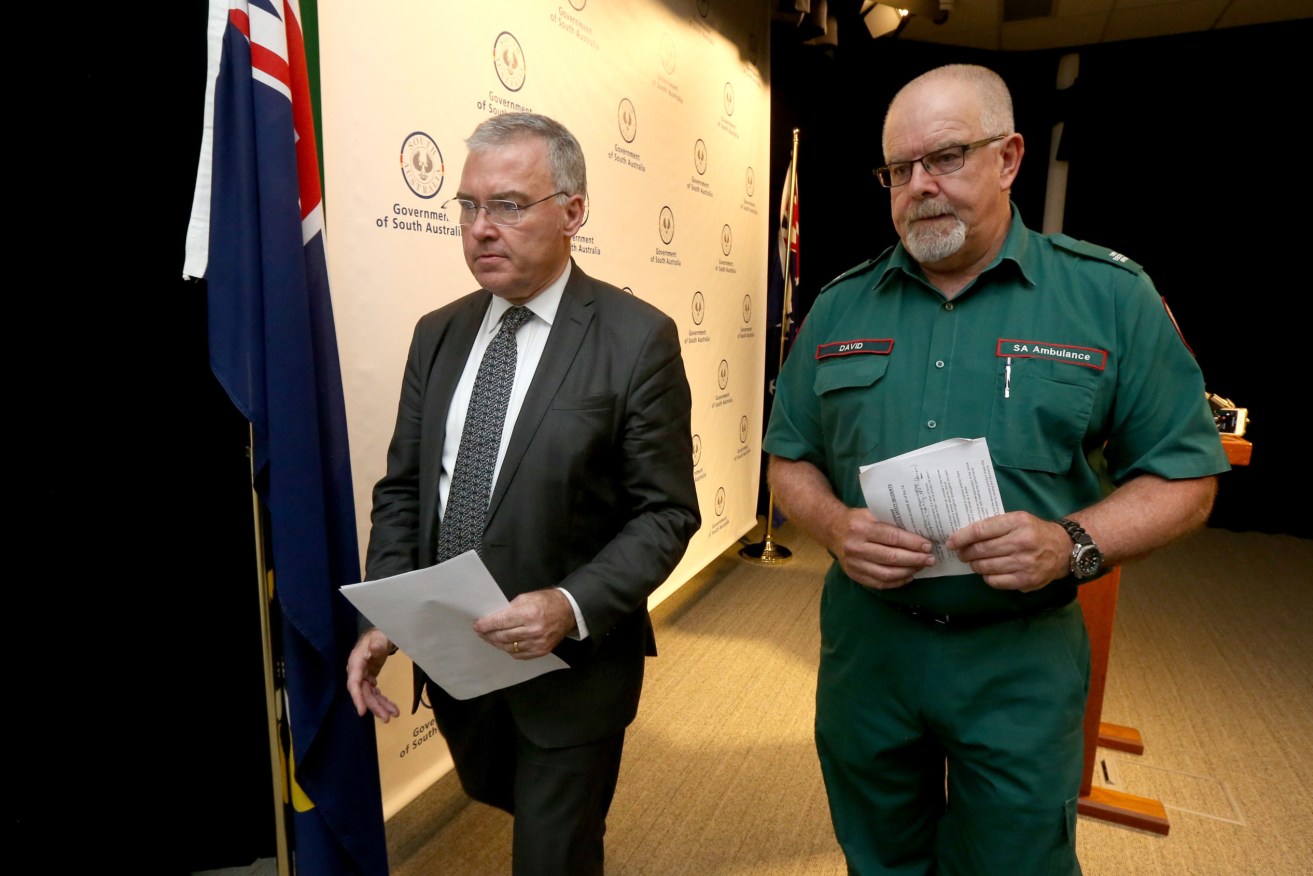 SA Health Minister Stephen Wade and SA Ambulance Service CEO David Place releasing the SAAS adverse incidents report in February 2019 (AAP Image/Kelly Barnes)
