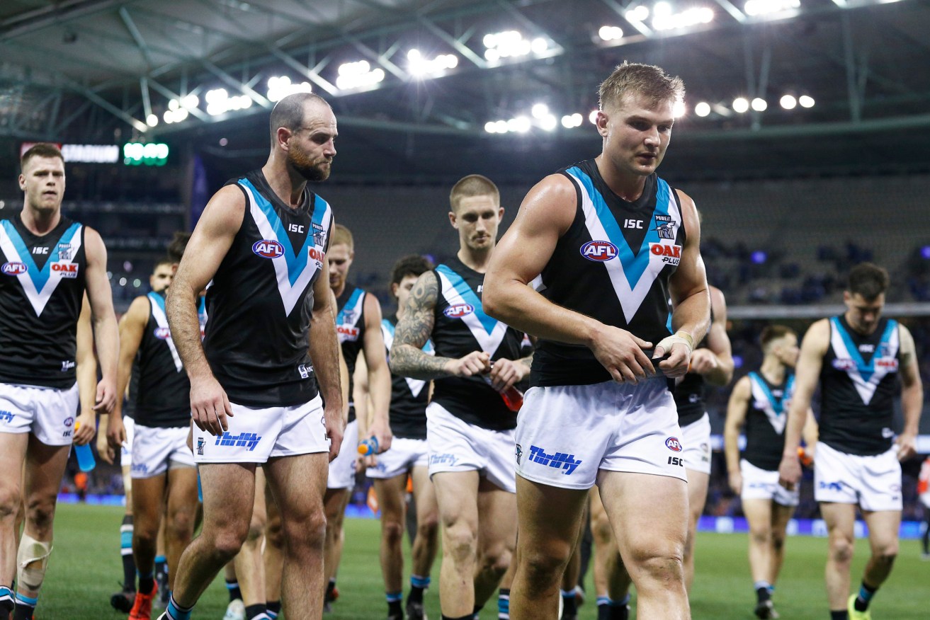 Ollie Wines leads Port players from Docklands in August 2019 - the last time the Power played in Victoria. Photo: AAP/Daniel Pockett