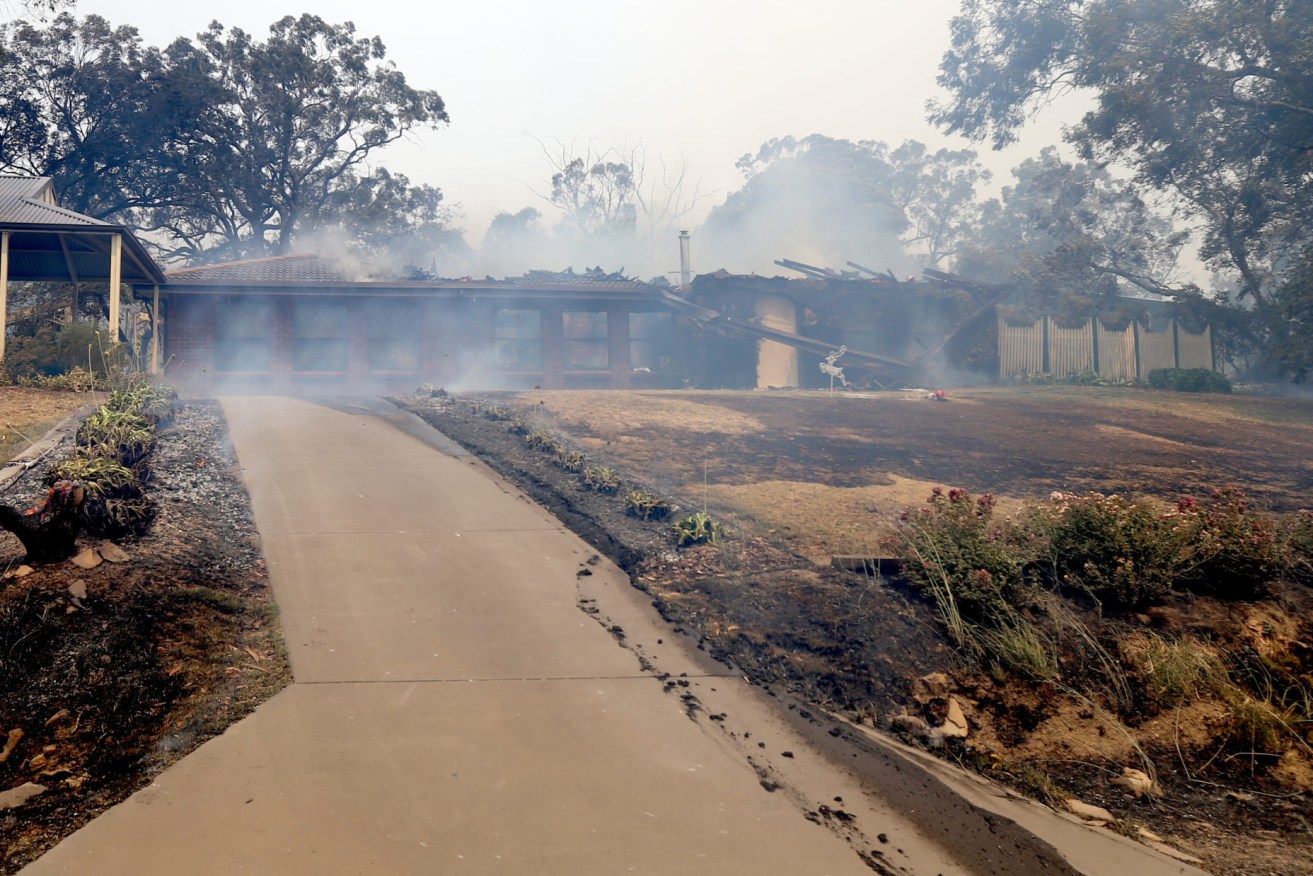 A home at Woodside during the Cudlee Creek bushfire. (AAP Image/Kelly Barnes)