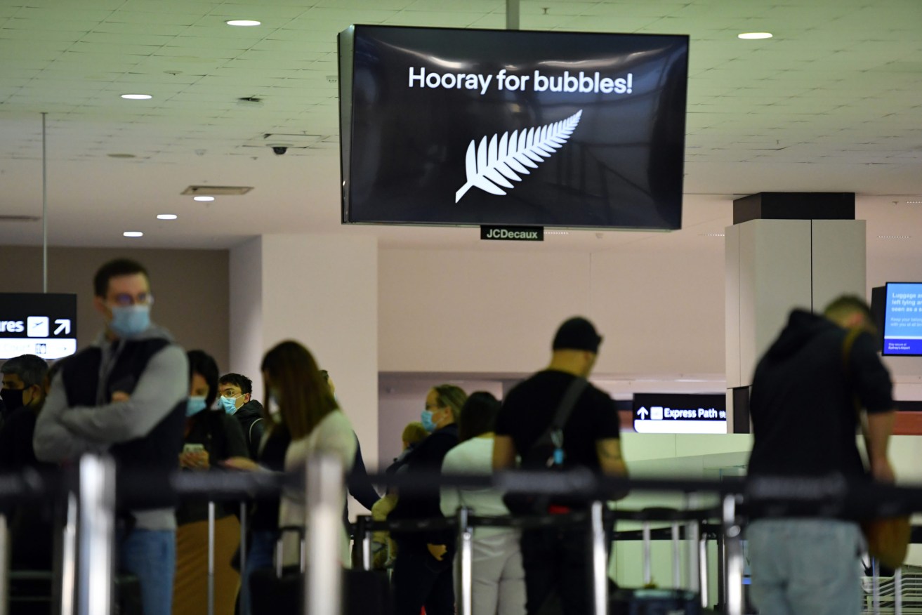 Passengers headed to New Zealand wait to check in at Sydney Airport yesterday. Photo: AAP/Mick Tsikas