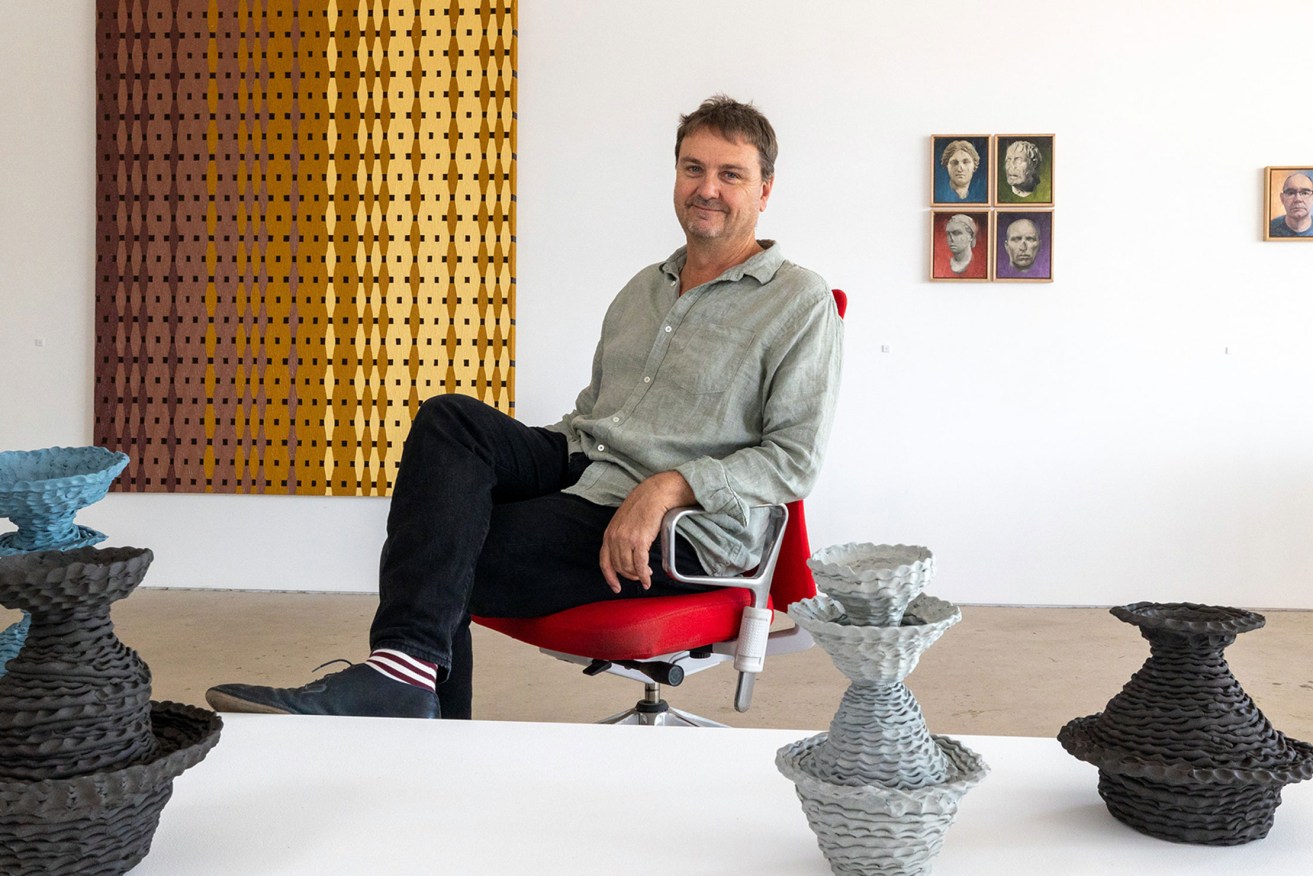 Southwest Contemporary director Craige Andrae, surrounded by works by Aldo Iacobelli, Daryl Austin and Sam Gold that are part of the current Project 9 exhibition. Photo: Tony Lewis  