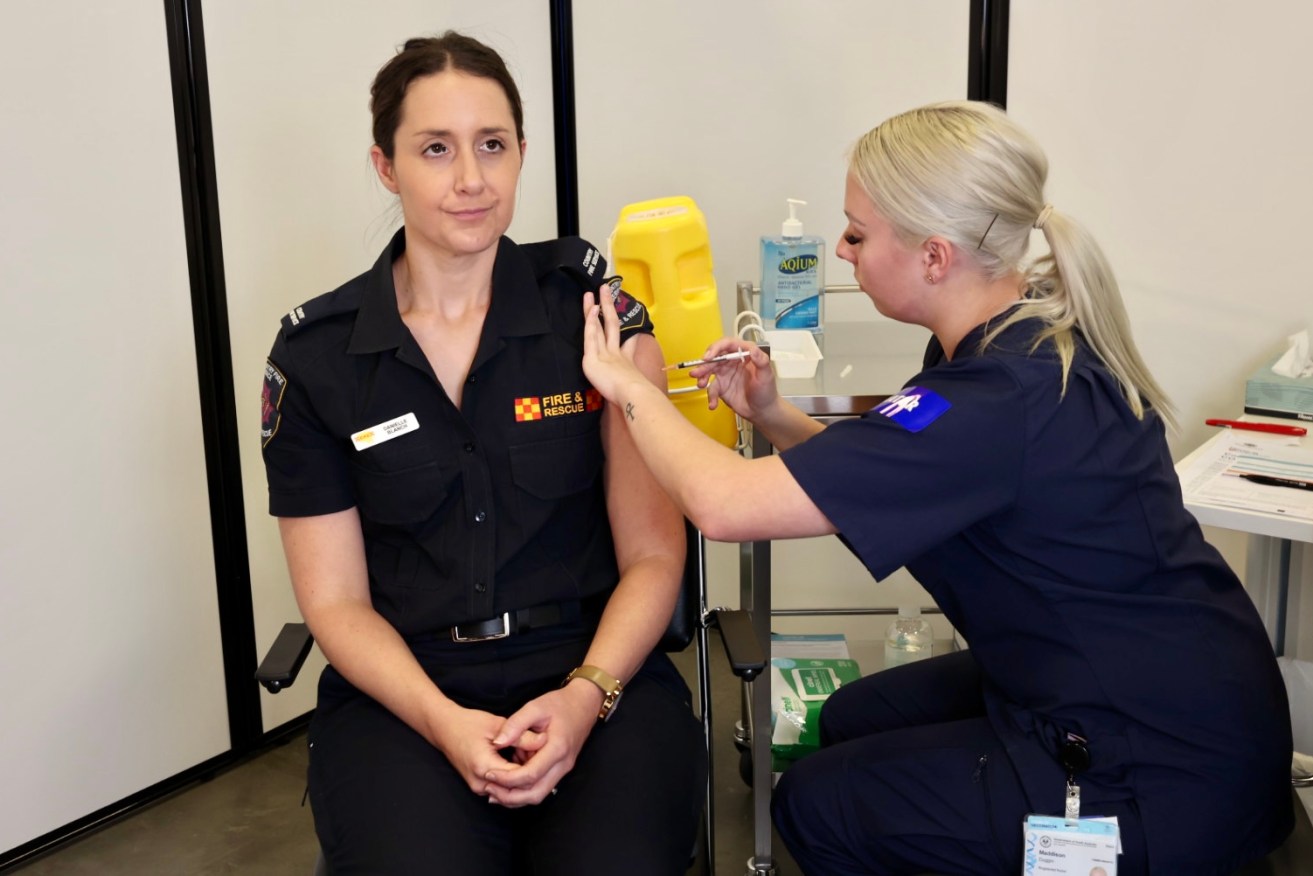 Nurse Maddie Duggan gives Danielle Blanch the first vaccination at the Wayville site. Photo: Tony Lewis/InDaily