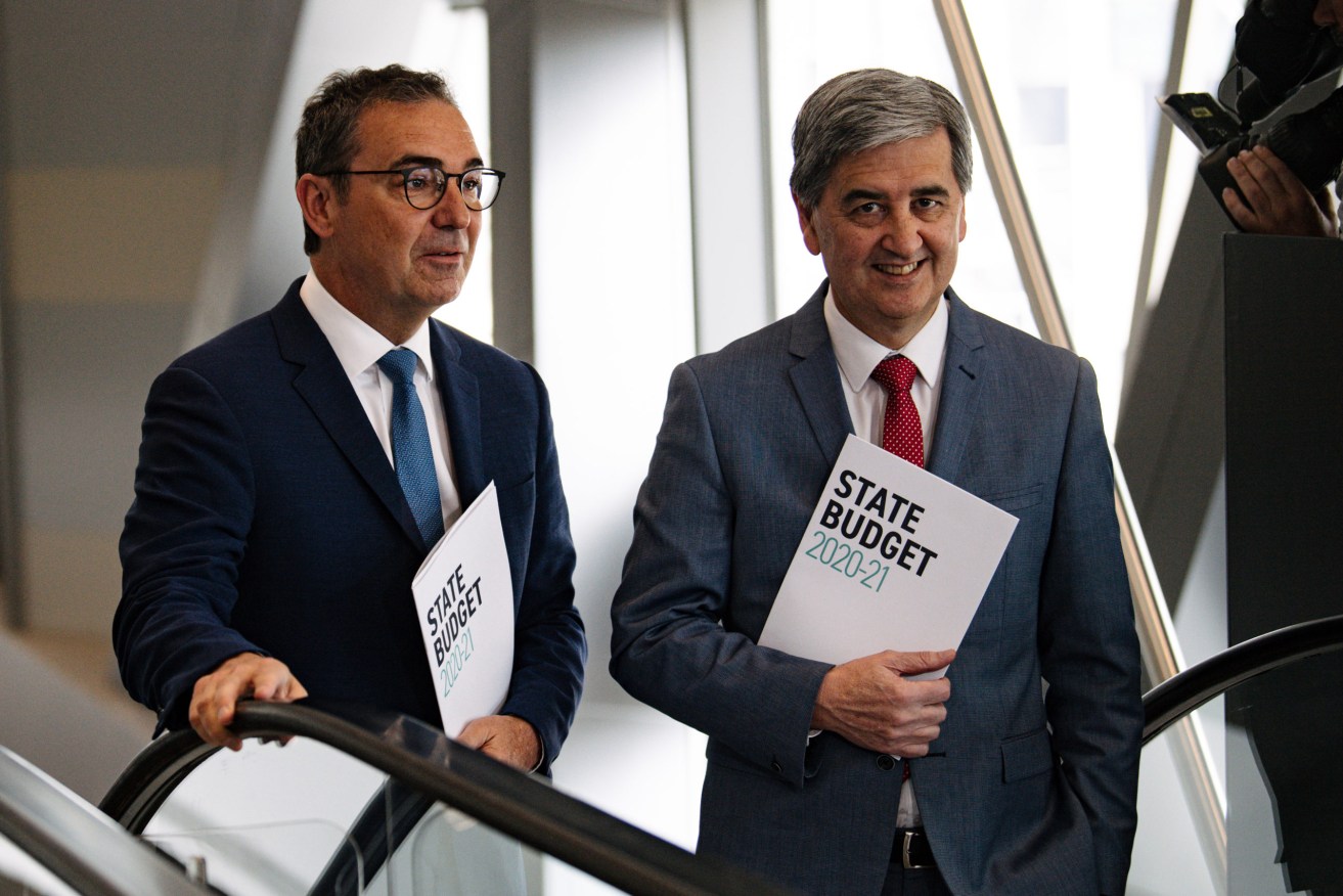 Steven Marshall and Rob Lucas with last year's state budget. Photo: Morgan Sette / AAP