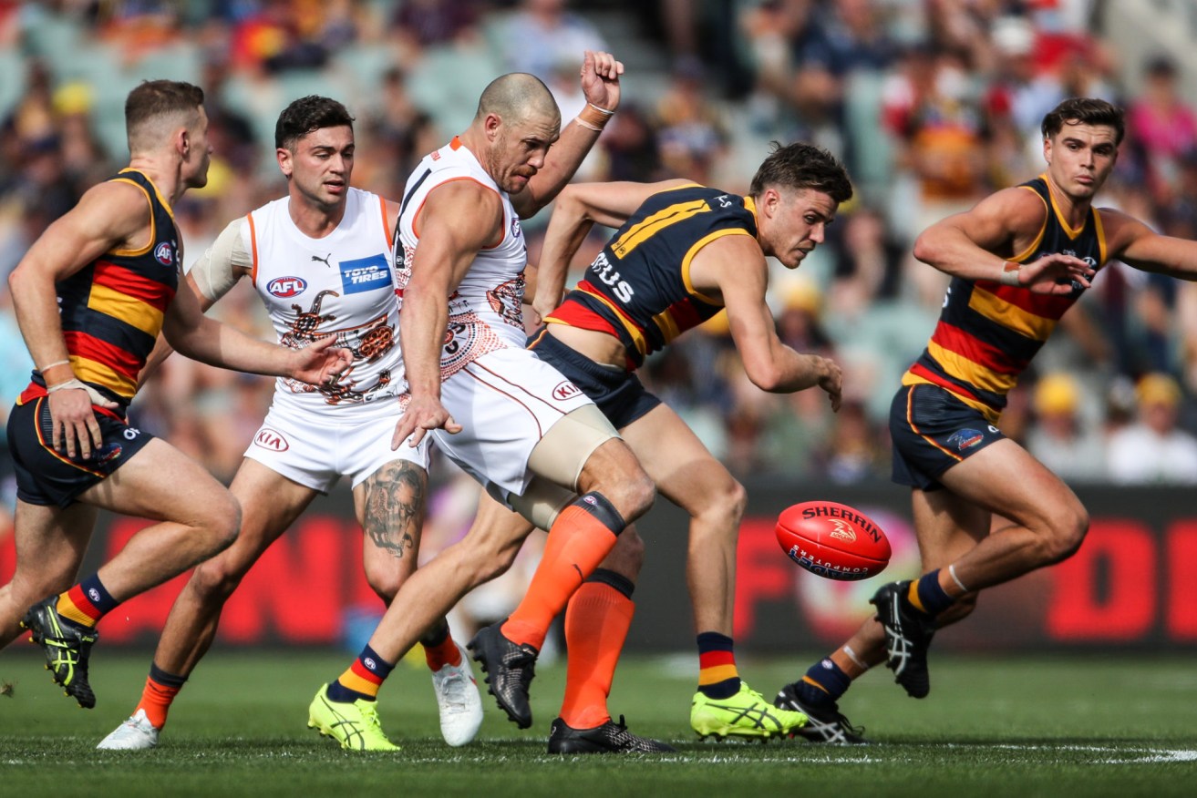 A lumbering Giant finds space against the Crows on Saturday. Photo: Matt Turner / AAP