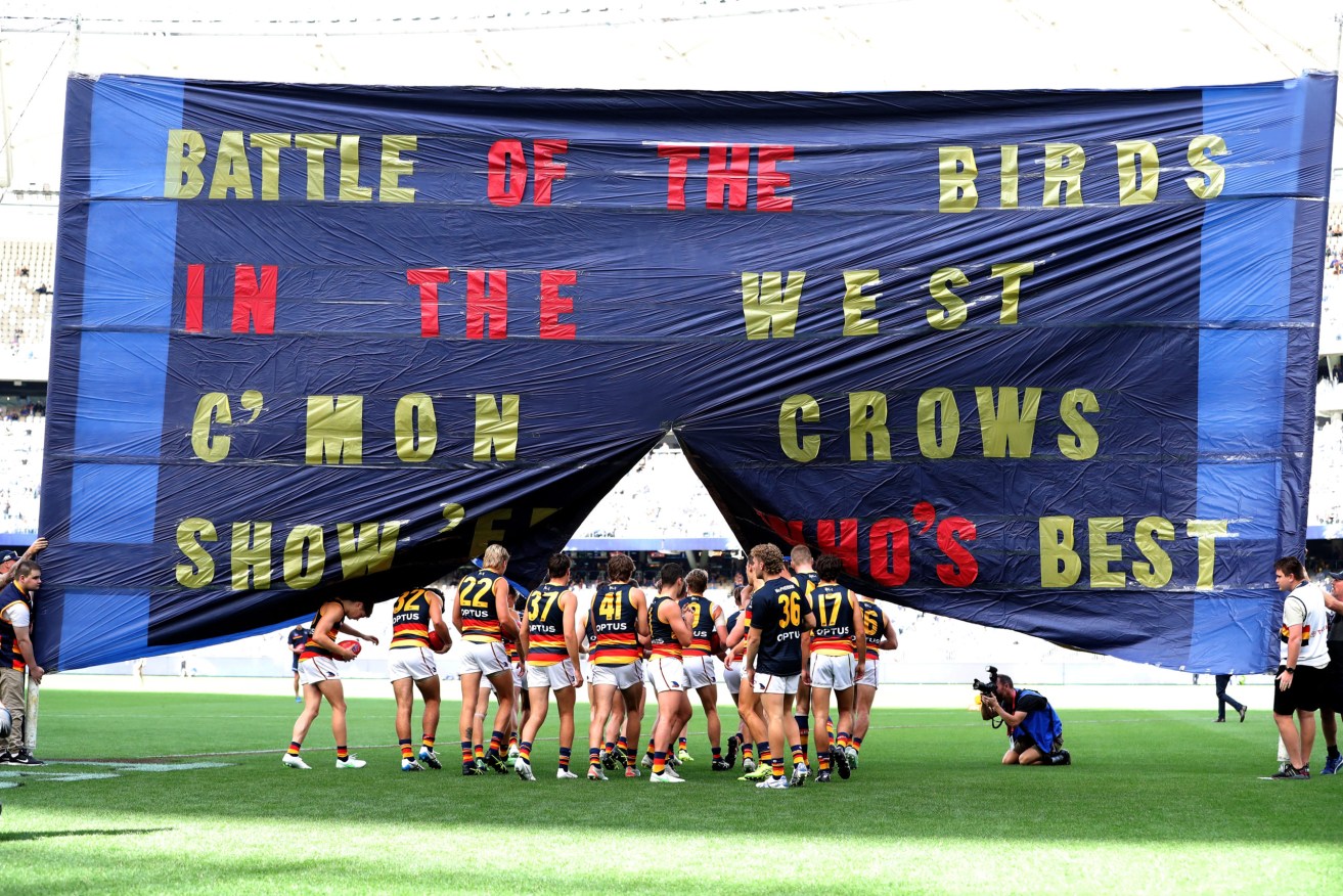 The Crows' banner exhorts the team to 'show 'em who's best'. Which, unfortunately, they did. Photo: Richard Wainwright / AAP