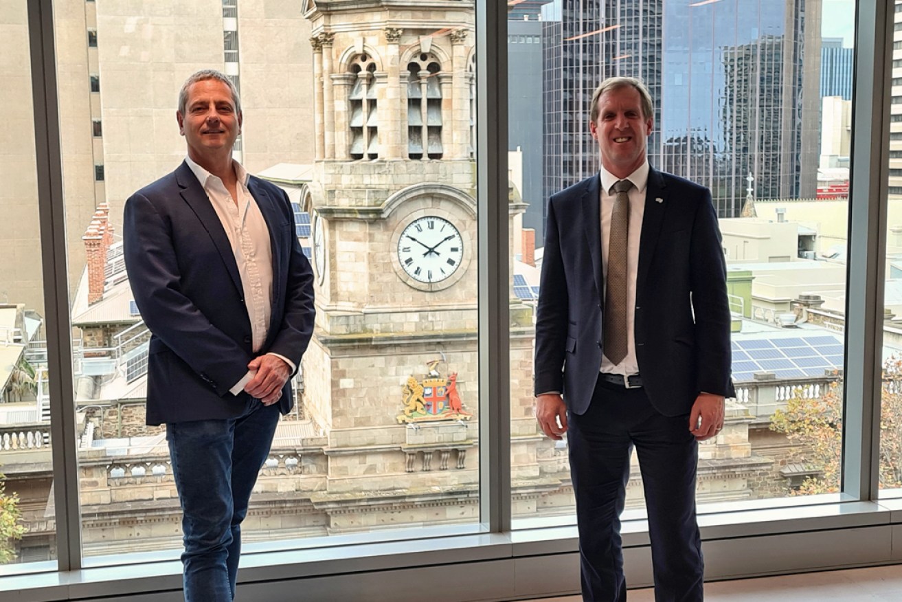 Tic:Toc CEO Anthony Baum (left) and Trade and Investment Minister Stephen Patterson at the opening of Tic:Toc's new King William St office in May. Picture: Andrew Spence. 