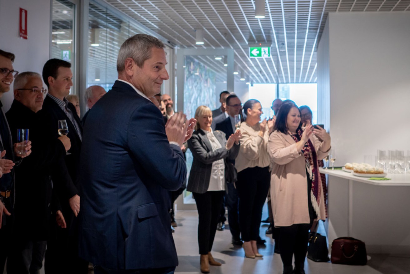 Tic:Toc founder and CEO Anthony Baum applauds the official opening of the digital lender's new Adelaide headquarters. Picture: Supplied