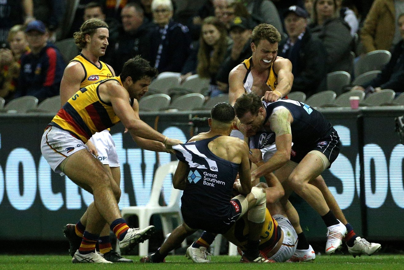 A melee after an on-field incident prompted by a condition known as 'Brain Fog'. Photo: Hamish Blair / AAP
