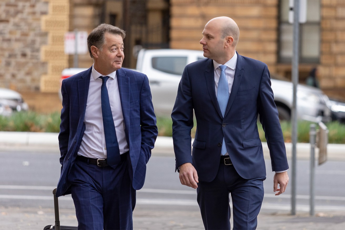 Sam Duluk (right) arrives at court with his lawyer. Photo: Tony Lewis/InDaily