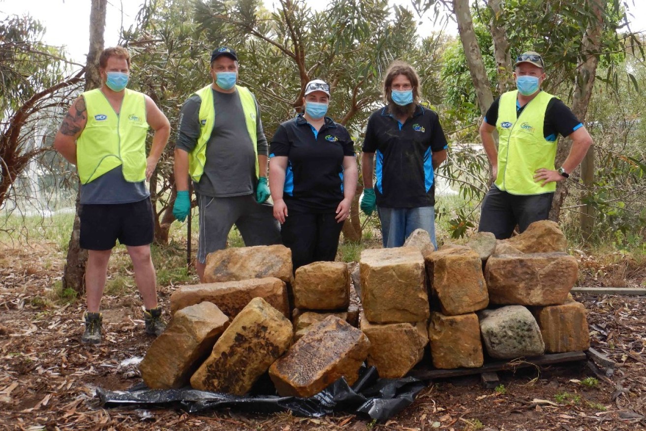 Members of the Barossa chapter of OzFish helped clean the blocks before installation in Warren Reservoir.