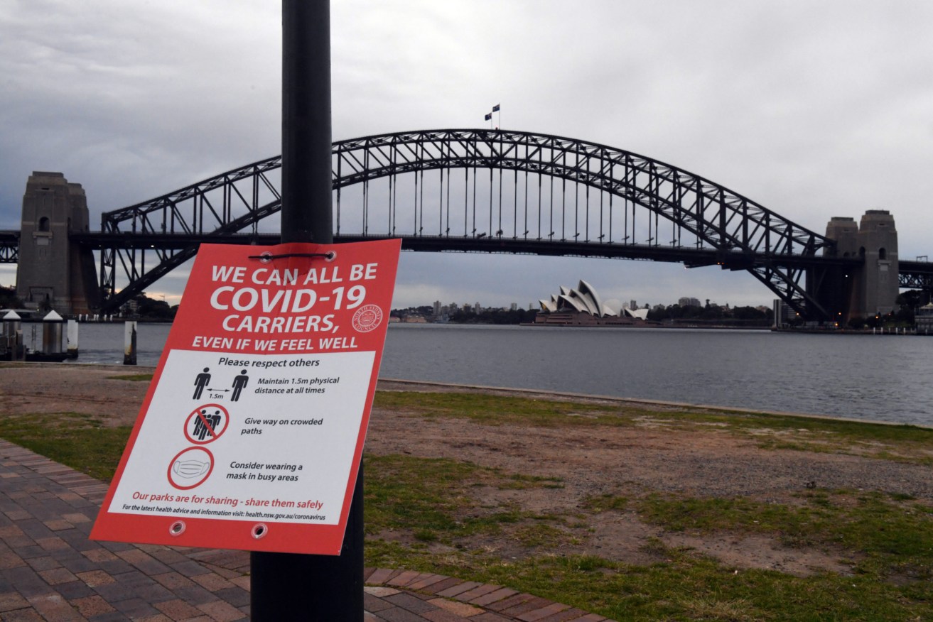 A Covid sign warning is seen at a ferry wharf in Sydney, Wednesday, July 28, 2021 (AAP Image/Mick Tsikas)