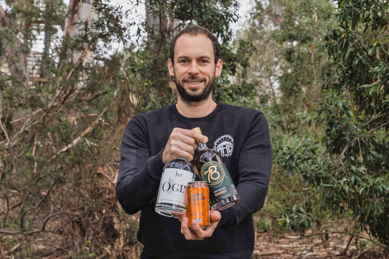 Adelaide Hills Distillery founder Sacha La Forgia with Mighty Craft products including his 78 Degrees Australian Whisky. 