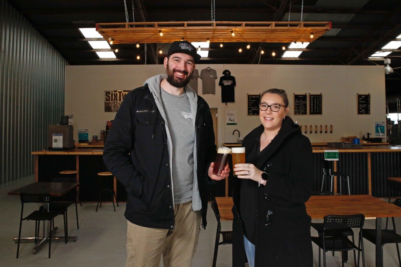 SixTwelve Brewing husband-and-wife business owners Brad and Alle Reid at their St Agnes brewhouse. Photo: Ben Kelly.
