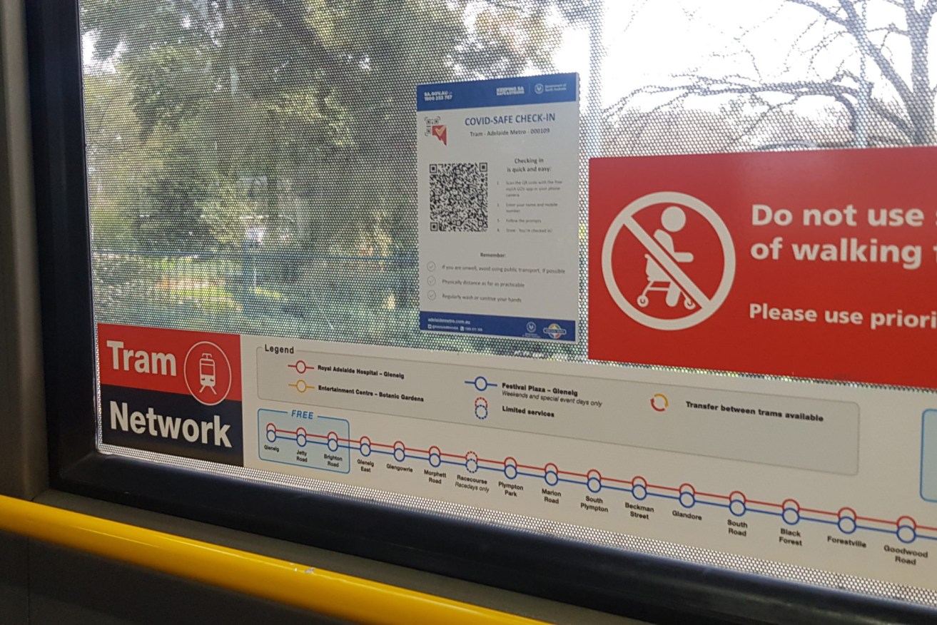 A QR code displayed on the window of an Adelaide Metro tram (Photo: Thomas Kelsall/InDaily)