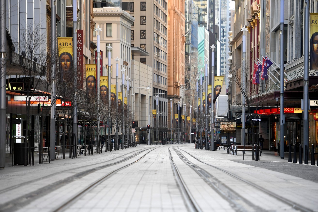Deserted George Street, in the heart of Sydney's central business district, on Thursday. Photo: AAP/Dan Himbrechts