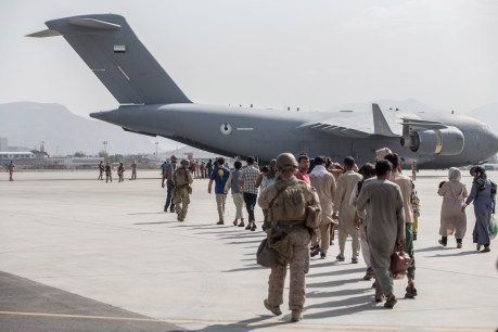 Taliban tries to control airport crowds as Kabul evacuations continue