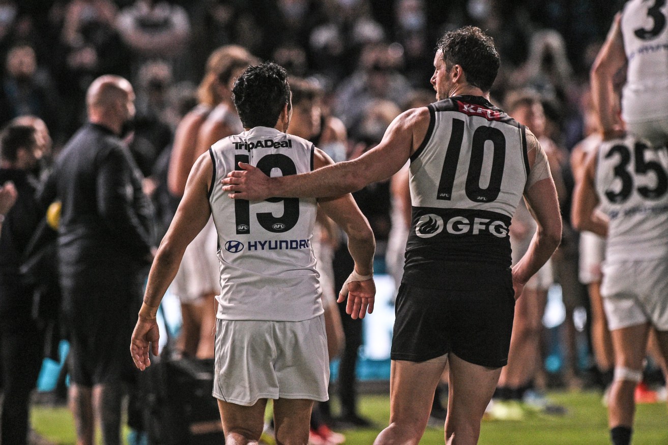 Travis Boak shares a moment with Eddie Betts, who is expected to confirm his retirement today. Photo: Michael Errey / InDaily