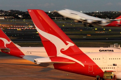 Qantas’ wings clipped as Woolworths profit soars