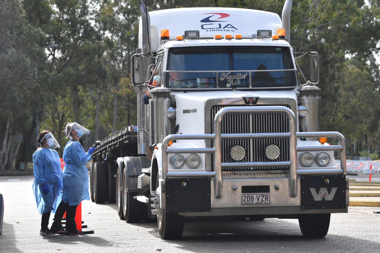 A truck driver is COVID-tested in Queensland. Photo: Darren England/AAP