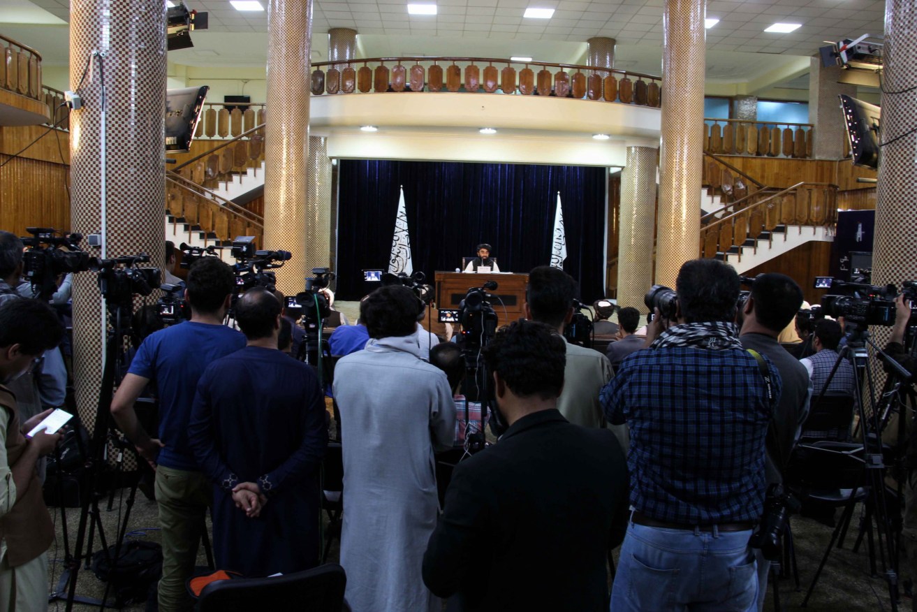 Taliban spokesman Zabhiullah Mujahid announces an interim government and declares Afghanistan an Islamic Emirate. Photo: EPA/STRINGER