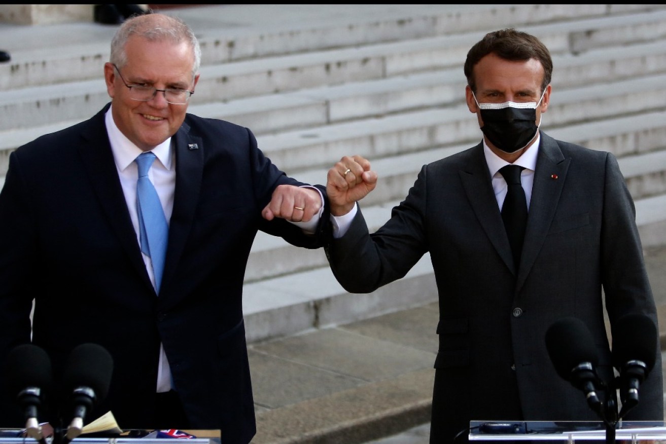 Prime Minister Scott Morrison met French President Emmanuel Macron in Paris in June but Macron only learned of the secretly-negotiated AUKUS deal just before it was announced. Photo: Rafael Yaghobzadeh/AP