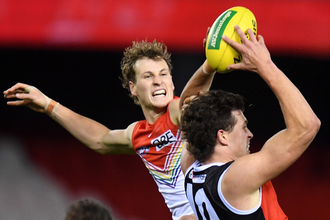 Jordan Dawson of the Swans (left) in action against St Kilda this year. Photo: AAP/James Ross