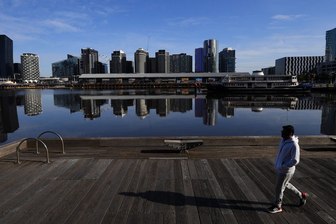 A person is seen exercising in Melbourne, Friday, October 8, 2021. (AAP Image/James Ross).
