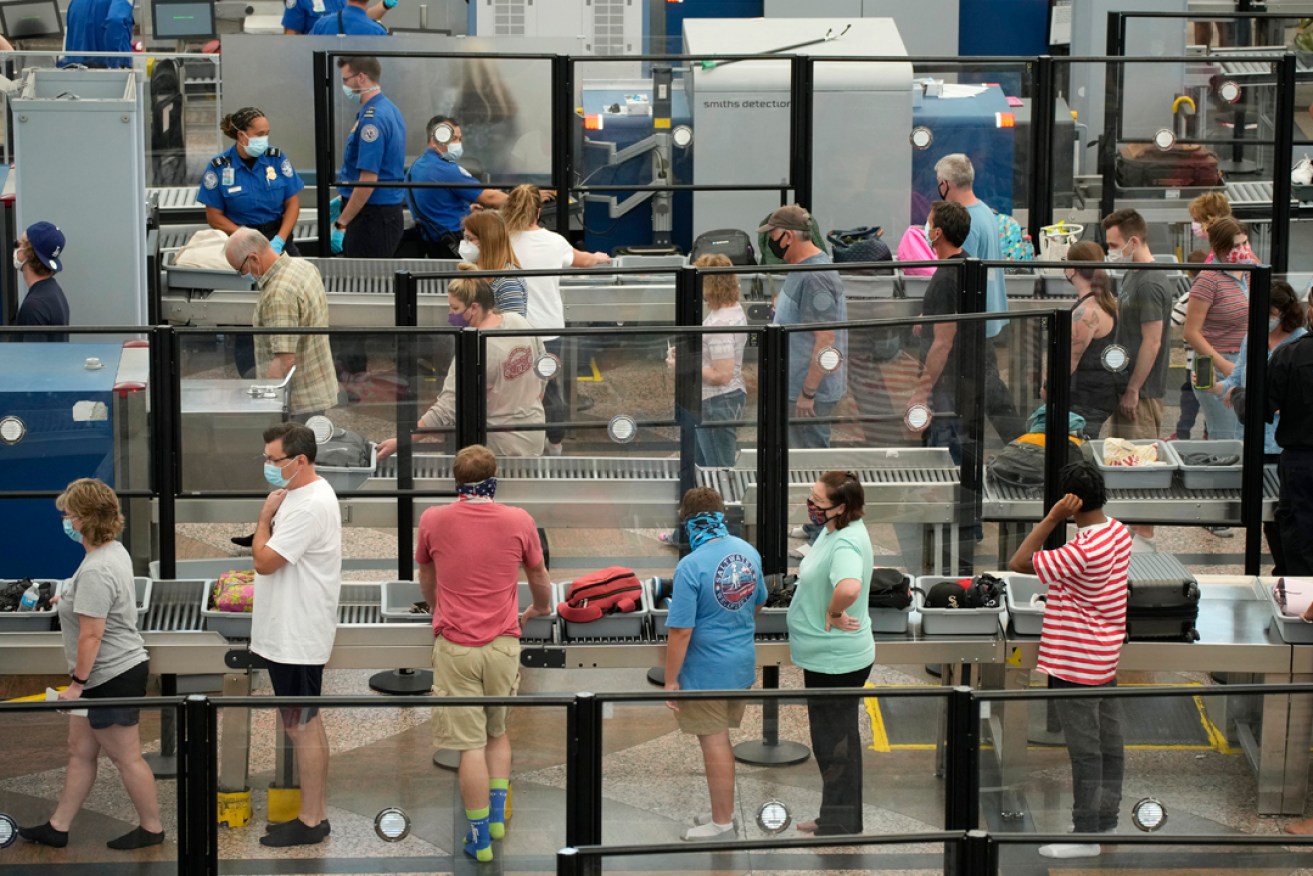Micro-X is working on an automated system to reduce airport wait times like the ones faced by travellers at Denver International Airport last month. Photo: David Zalubowski/AP.