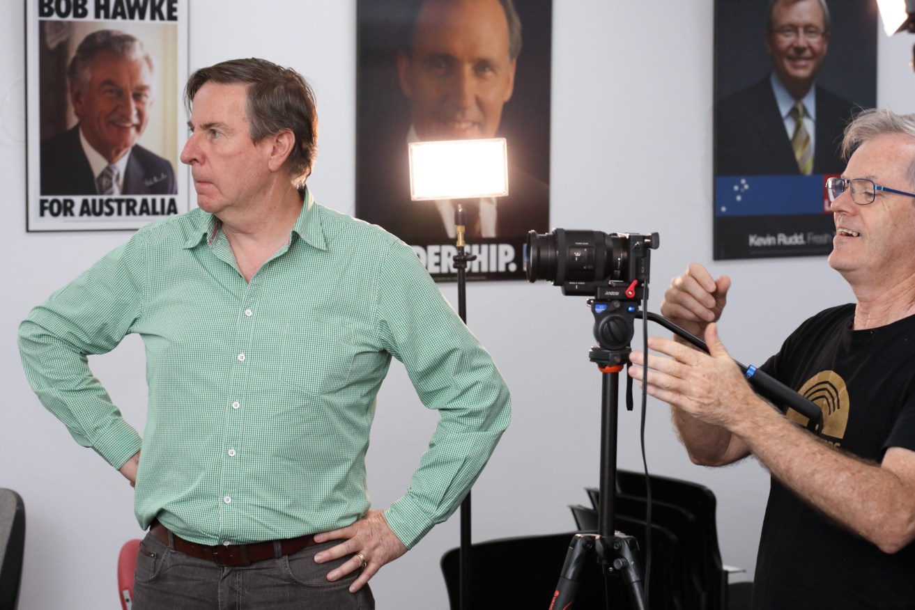 Peter Hanlon filing a documentary in the ALP's city office with cinematographer Rick Davies in 2017. Photo: Tony Lewis / InDaily