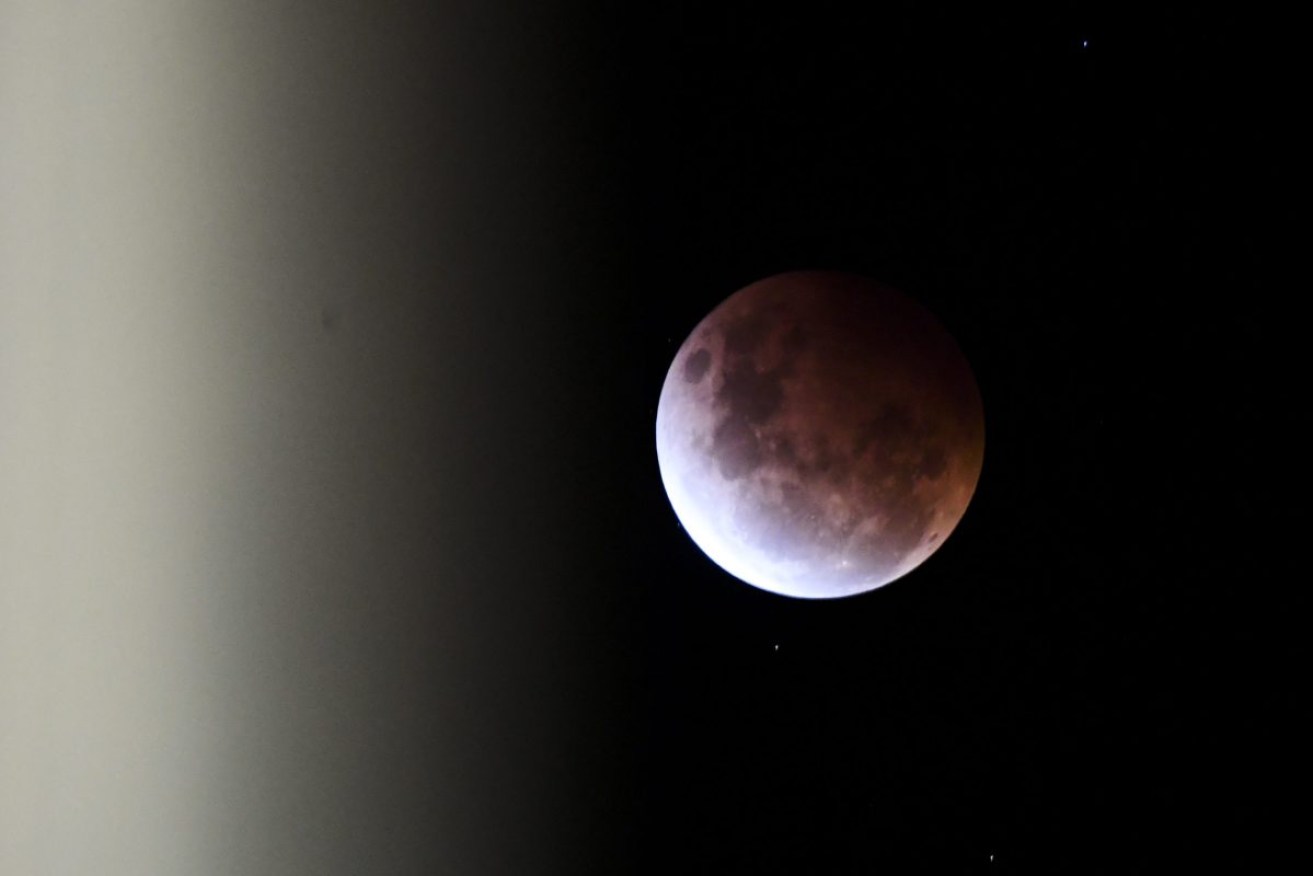 A super blood moon above Canberra in May. Photo: AAP/Lukas Coch