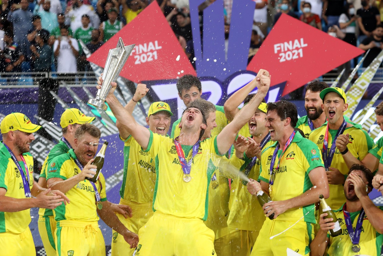Mitchell Marsh (centre) leads Australian celebrations after the team won the T20 World Cup in Dubai. Photo: AAP/David Gray