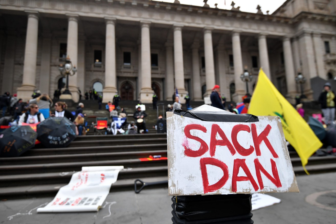Demonstrators at State Parliament protest Victorian Government pandemic powers legislation. Photo: AAP/Joel Carrett