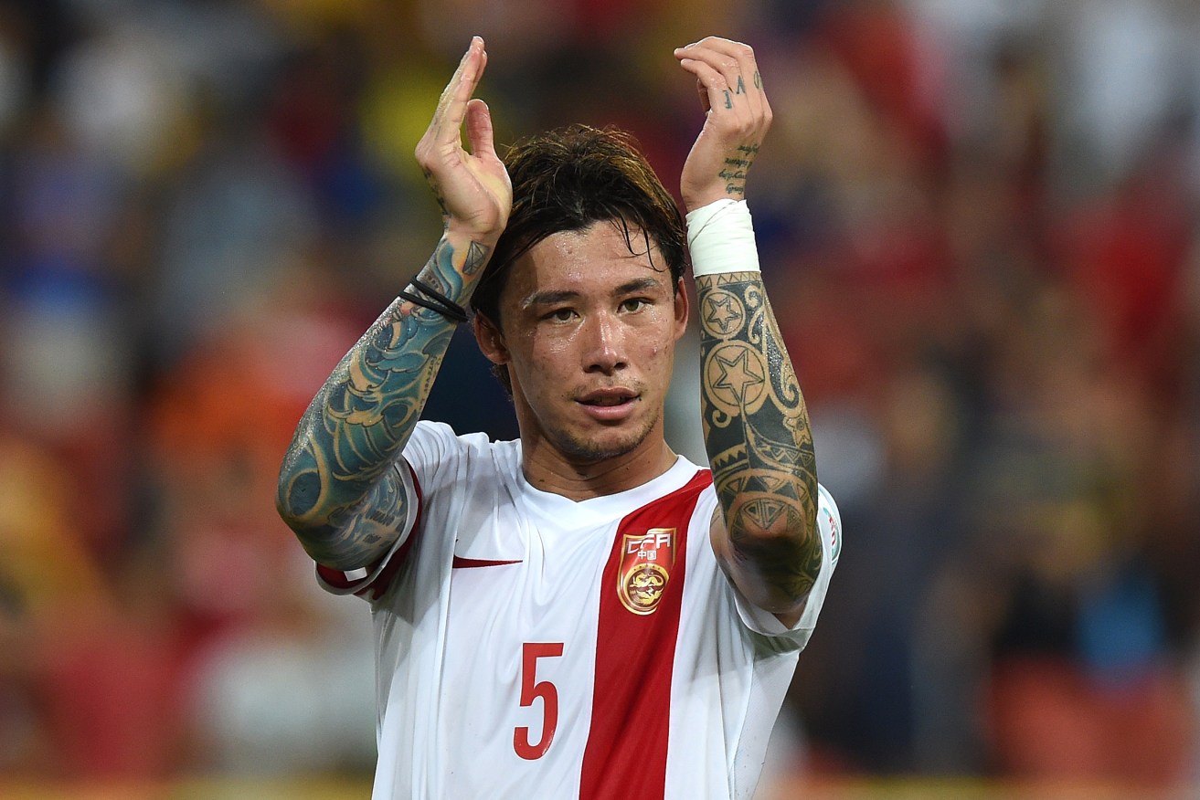 China's Zhang Linpeng. National team players have been banned from getting tattoos, with those already inked ordered to cover up or remove them. Photo: AAP/Dave Hunt